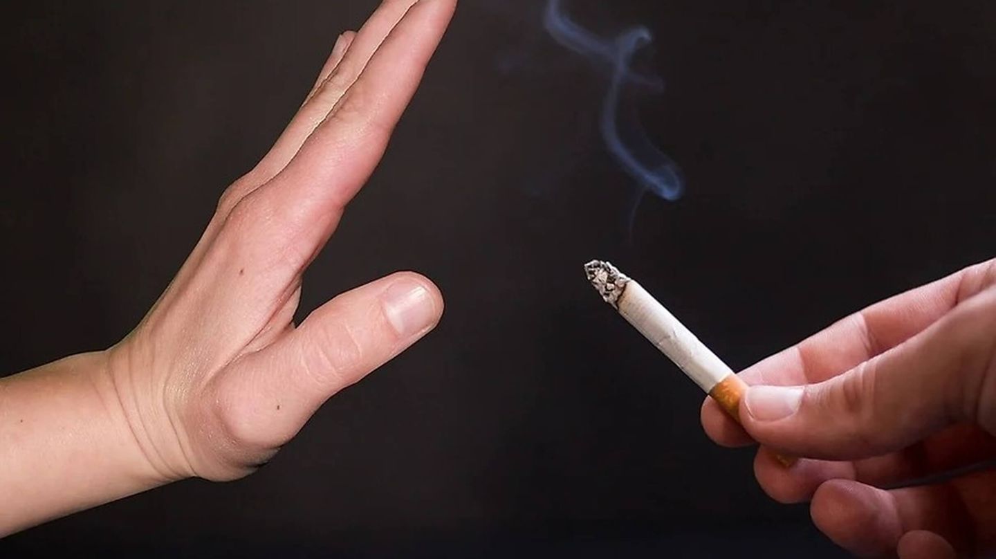 Hand declines a cigarette