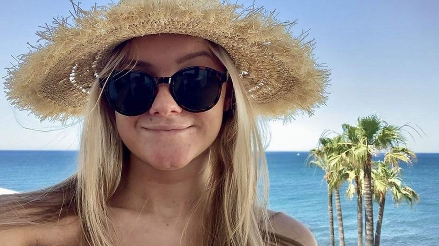 Girl on the beach with sunglasses