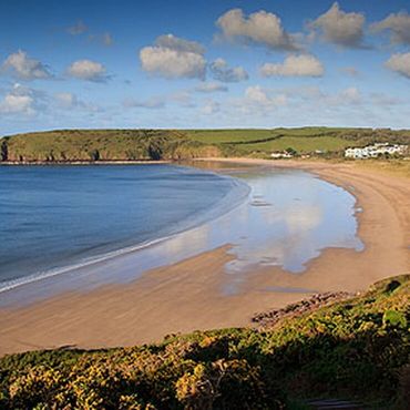 Freshwater East Beach at low tide with views over Trewent headland