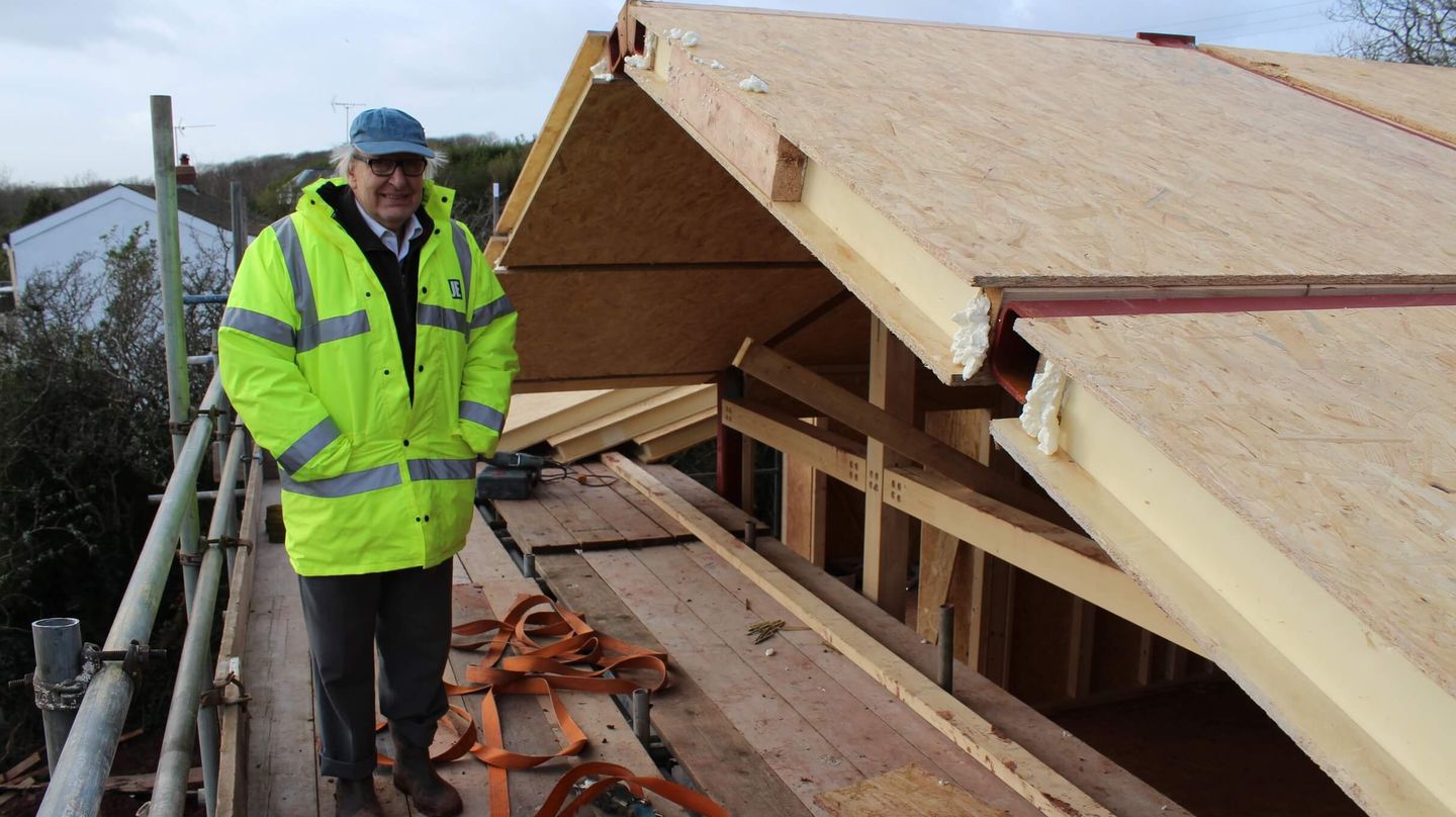 Garth Carroll standing on the scaffolding at roof level at Greenshutters