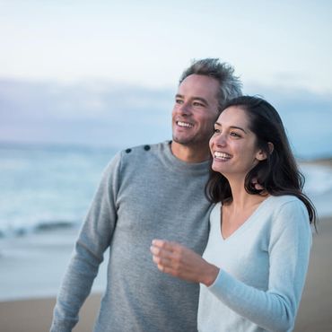 Smiling couple on the beach