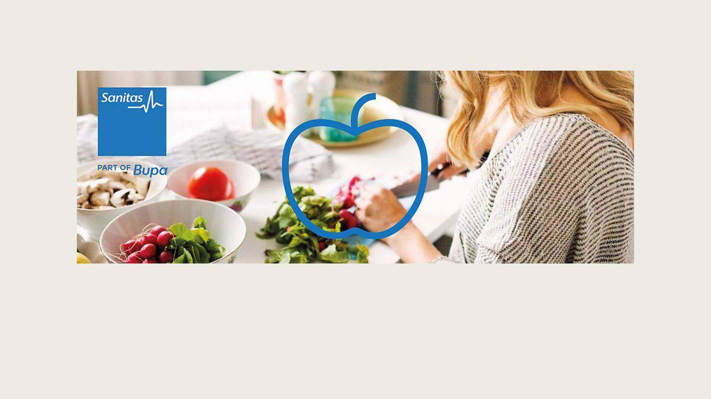 Woman cutting veggies in kitchen