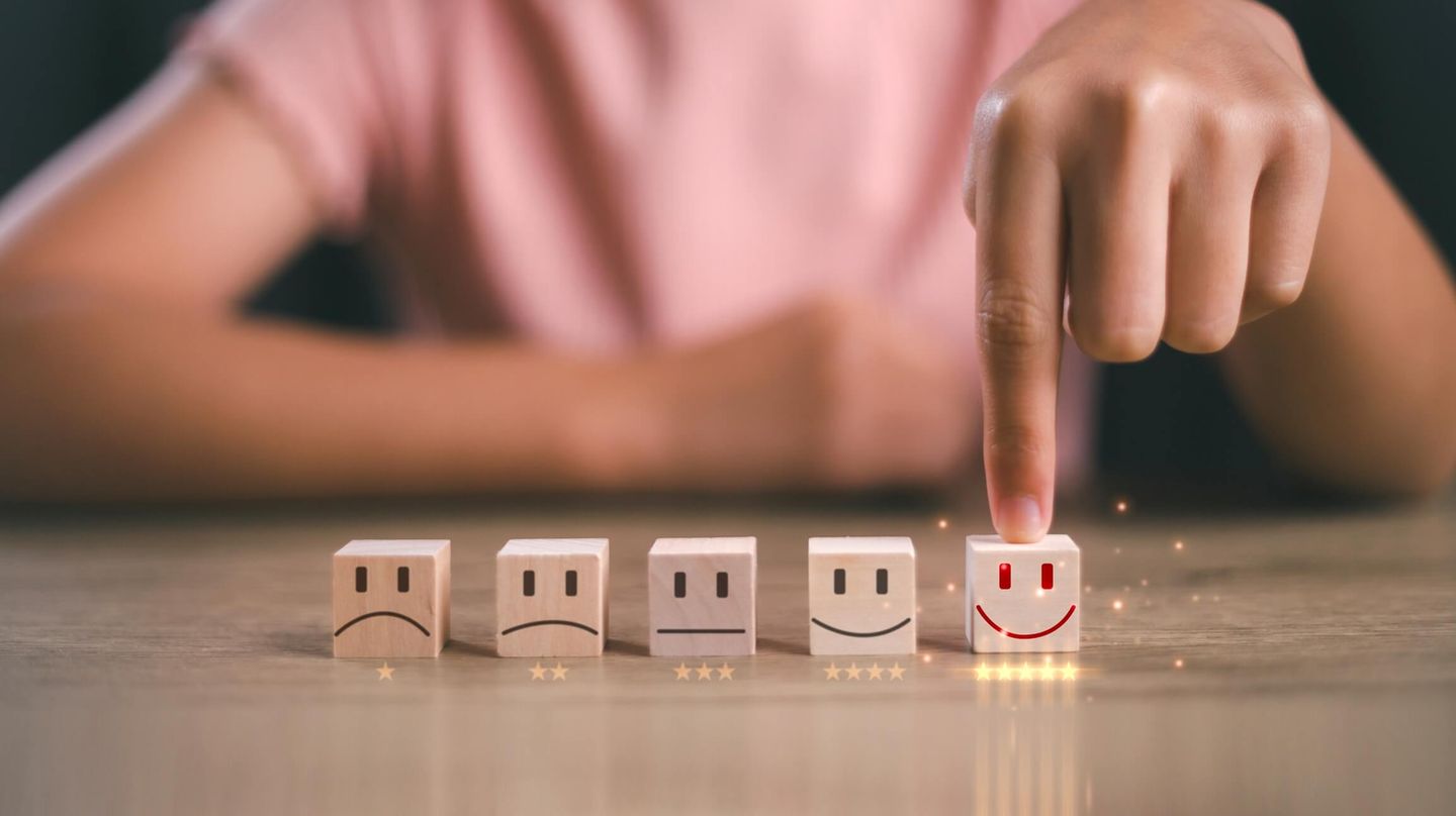 Woman choosing the cube with a smile on