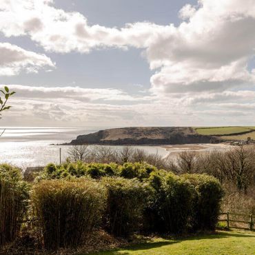 View taken from the balcony over the garden towards Trewent headland and the Bristol Channel beyond