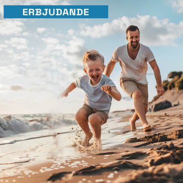 Father and son playing on the beach