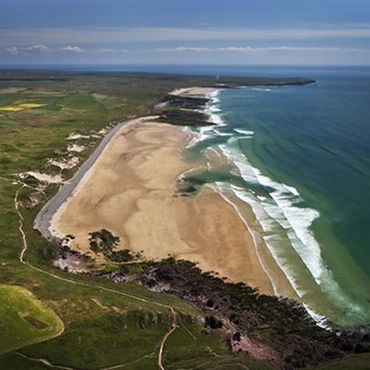 Aerial view of Freshwater West Beach.Dobby’s grave is a popular, unofficial memorial located in the sand dunes at Freshwater West beach in Pembrokeshire, Wales