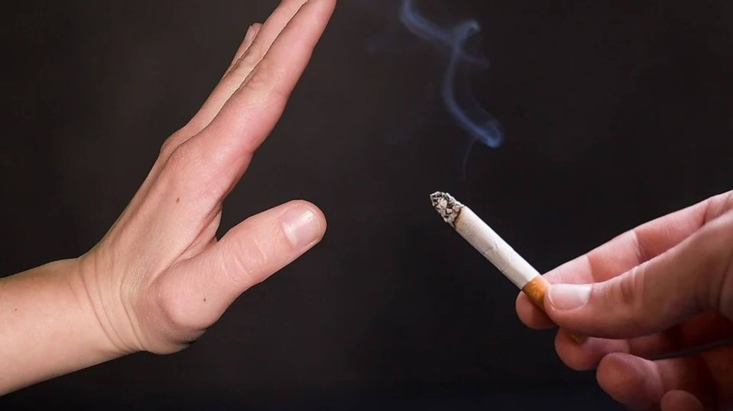 Hand declines a cigarette
