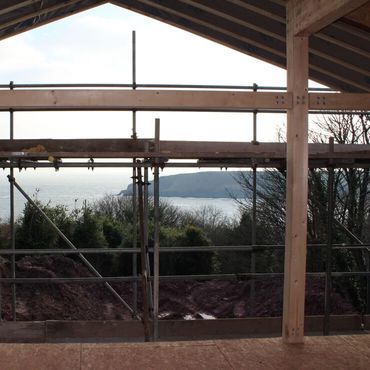 second floor and roof going up with indication of what the framed view from living room would now look like