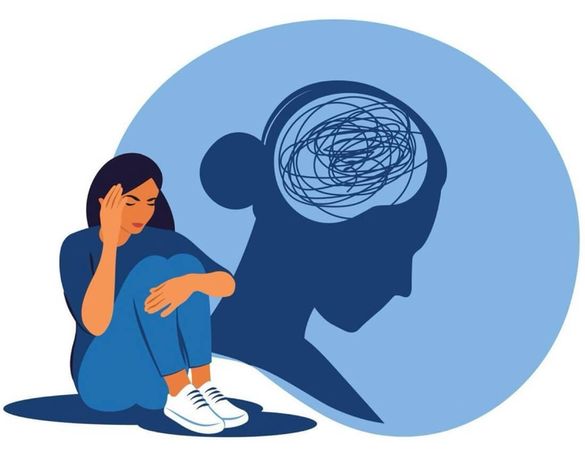 A woman sits in emotional discomfort, symbolizing mental strain and the impact of stress.