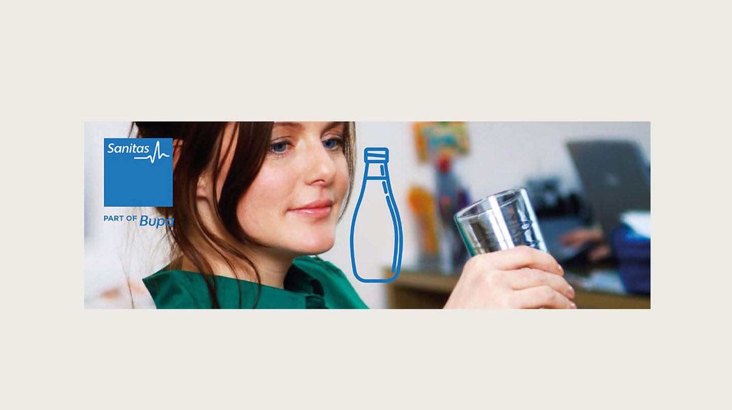 Girl holding a glass of water
