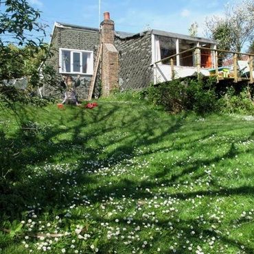 View of Greenshutters from below looking up at the balcony